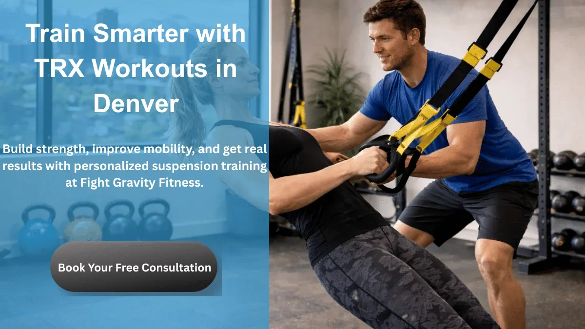 Personal trainer coaching client with TRX suspension training in Denver gym