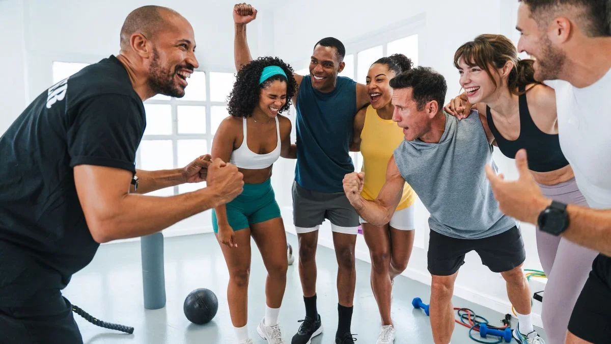 Trainer Celebrating with Clients