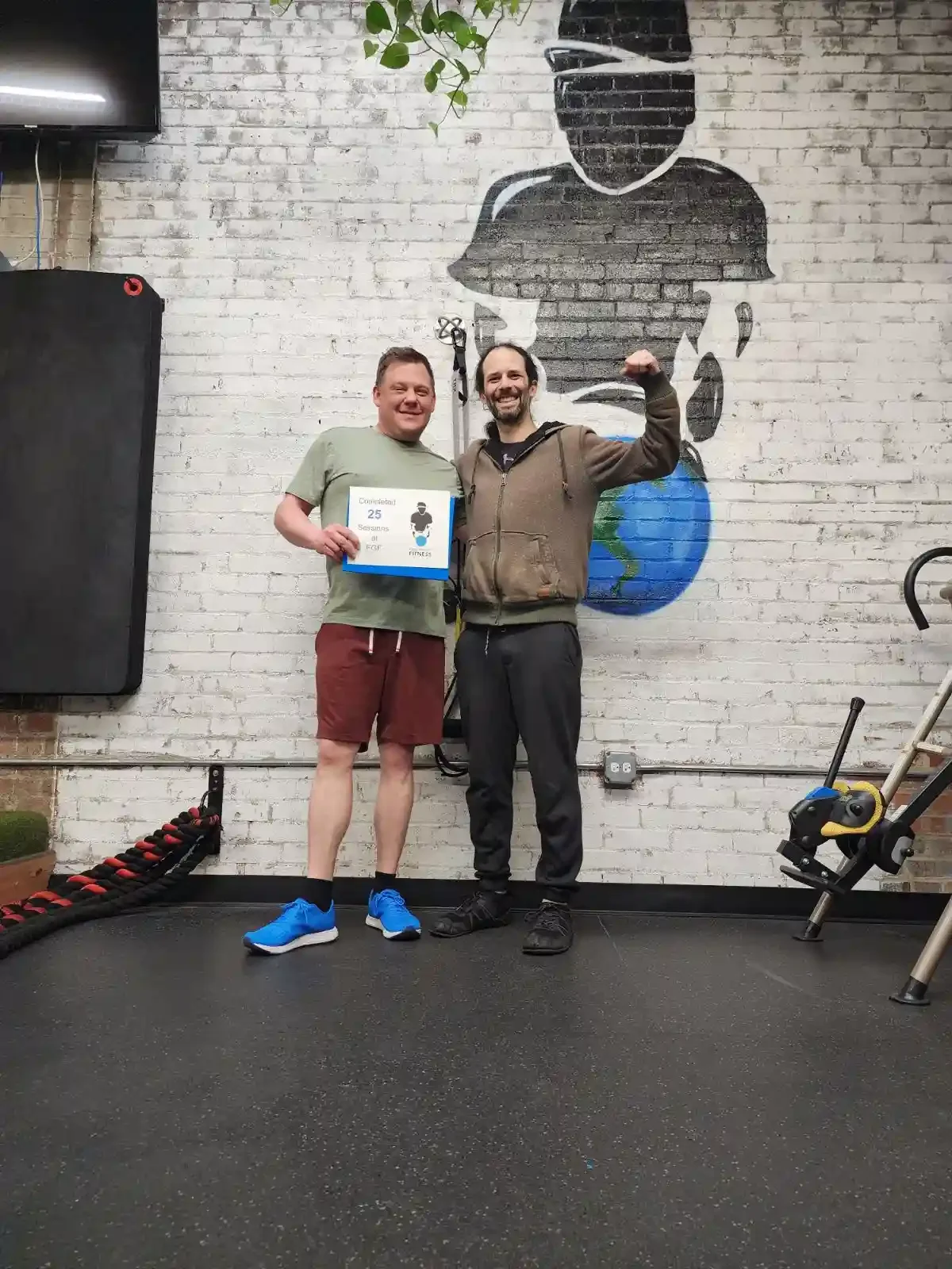 Fight Gravity Fitness Client celebrating 25 sessions with trainer