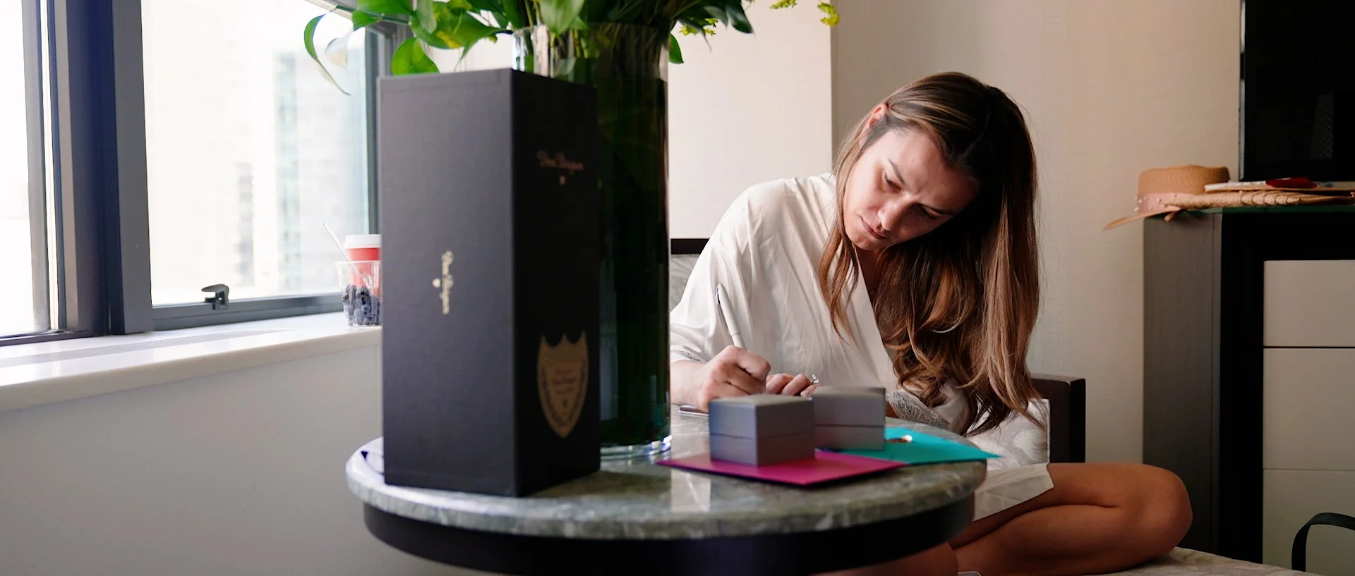 A bride writing her vow for a wedding ceremony.