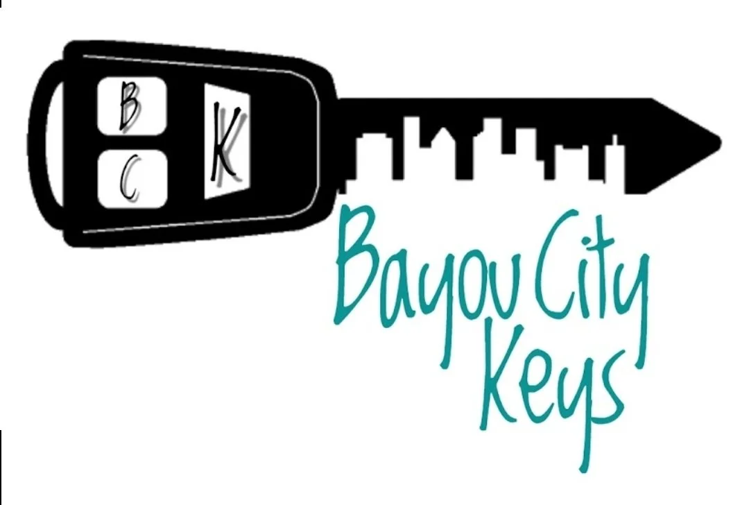 Illustration of a car key fob with the letters B, K, and C in circles, and a key blade attached, with handwritten text 'Bayou City Keys' beneath.