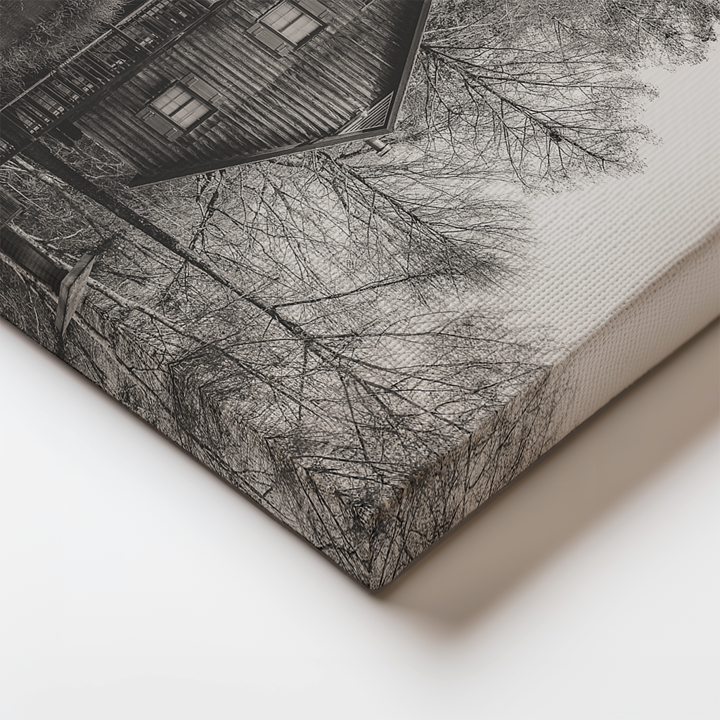 Close-up of canvas edge featuring the weathered textures of wooden cabins on the bayou in moody monochrome.