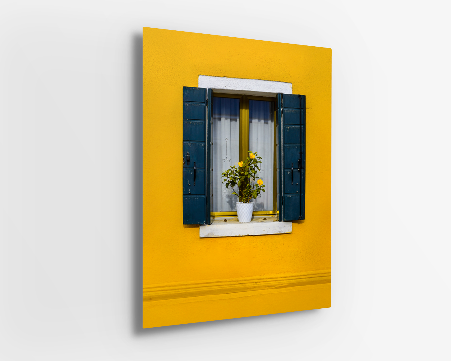 Metal print of a vivid yellow Italian window scene with rustic shutters and cheerful potted plant.