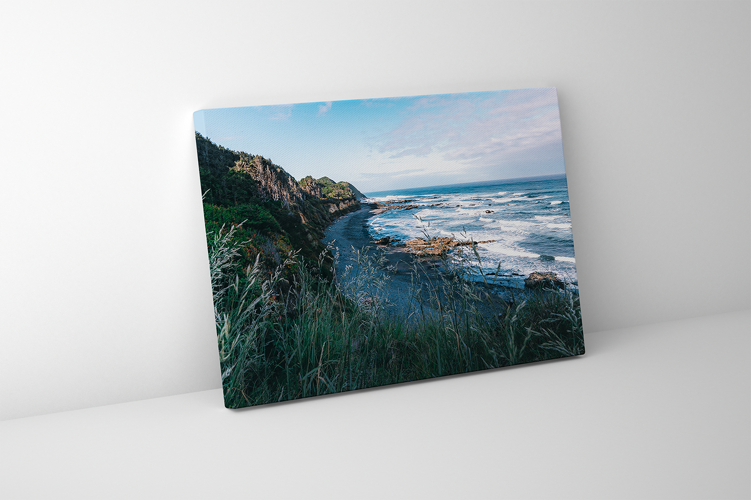 Gallery-wrapped canvas print featuring waves crashing against rocks and rugged cliffs on the Oregon Coast.