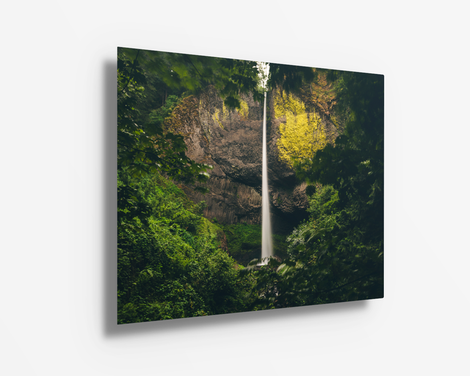 Latourell Falls presented in rich, high-contrast tones on a metal print, with sharp details in the basalt cliff and surrounding foliage.