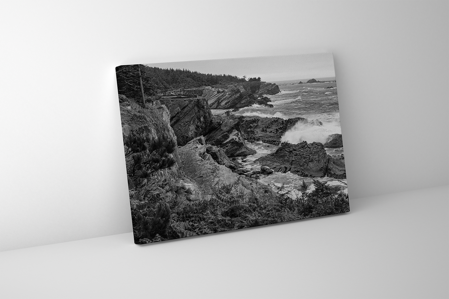 Gallery-wrapped canvas of dramatic seascape with layered rock formations and churning Pacific surf.