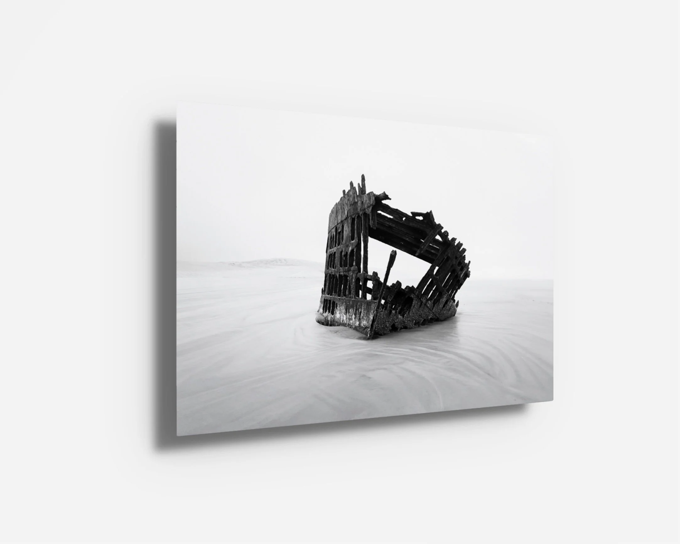 Metal print of a minimalist shipwreck scene on the Oregon coast with smooth tonal gradients and strong texture.