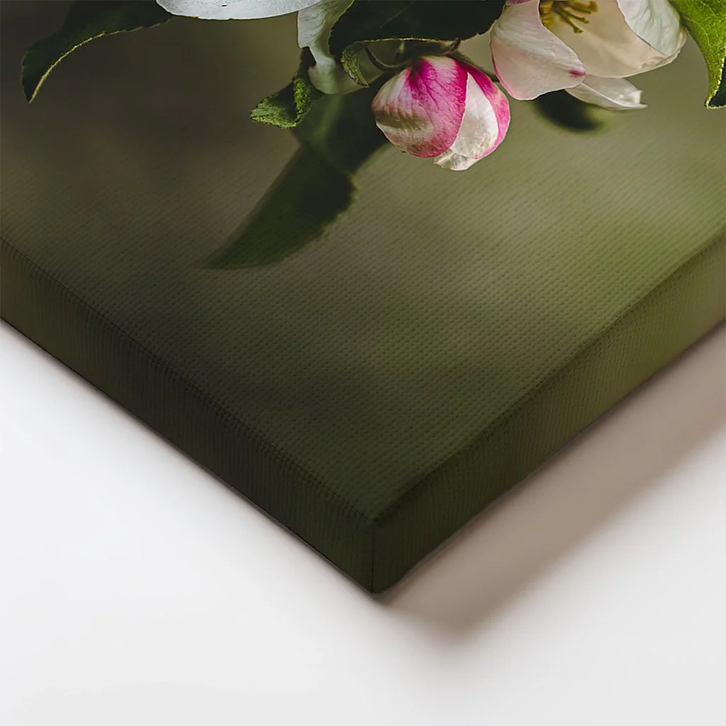 Canvas edge detail showing wrapped floral textures and soft green background from the apple blossom scene.