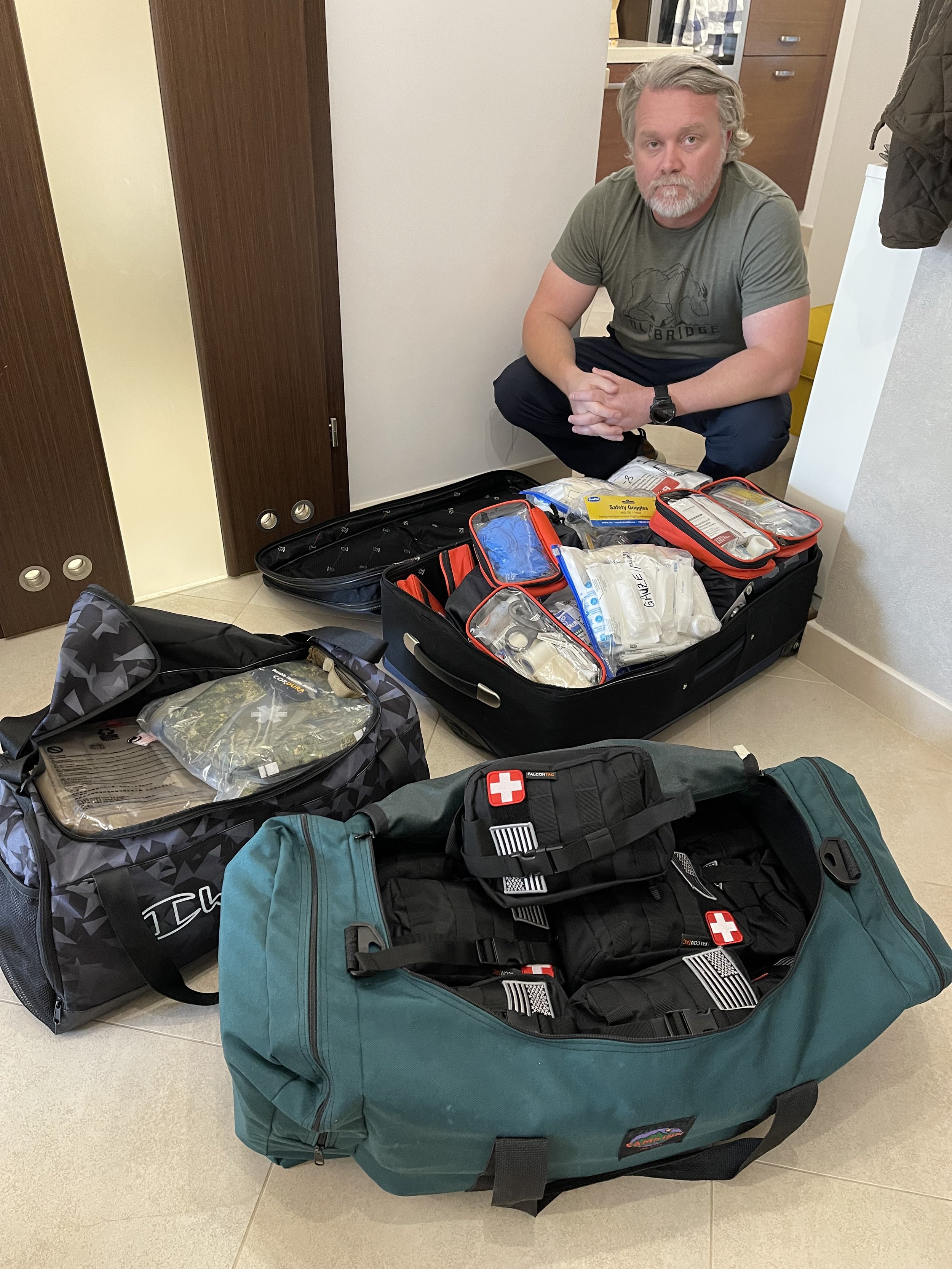Matt with donated medical supplies and IFAKs