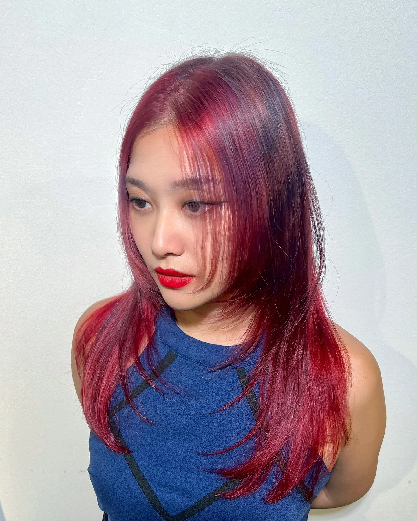 Hair transformation incoming! Phoenix red base with black stripes, topped off with a layered cut 🐦&zwj;🔥 A fashion colour for our project makeover participant @shibarain who is not afraid stun with her boldness &amp; creativity ❤️&zwj;🔥 Swipe to s