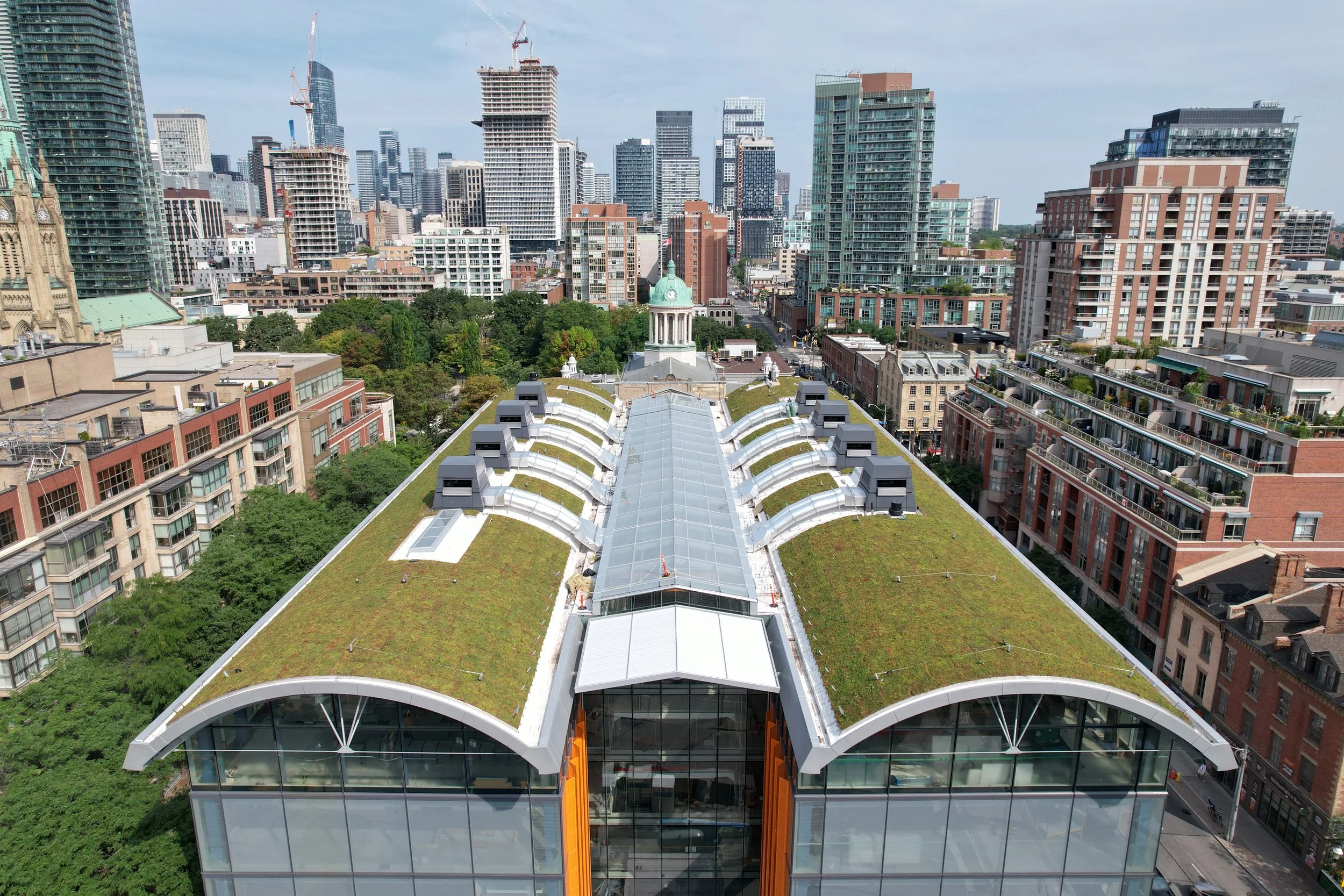 20 Amazing Buildings with Green Roof Designs - Home Stratosphere - Penthouse Buildings With Green Roof