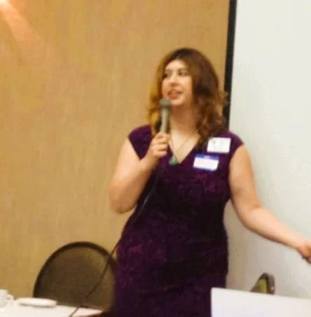 Dawn with a microphone speaking on Capitol Hill