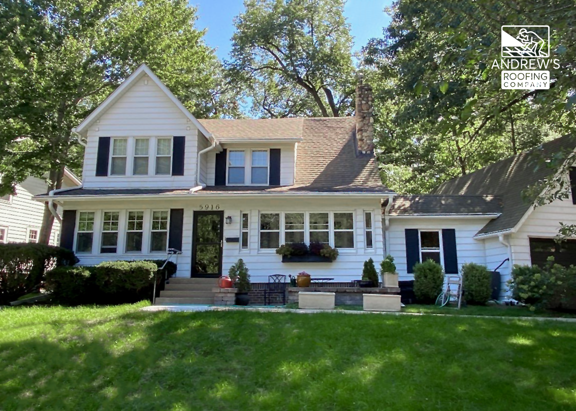 Front view of a white home before siding project began.