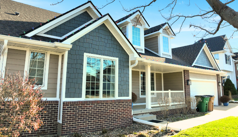 New James Hardie Siding at Ponderosa Dr in West Des Moines. Showing the front of the house with new siding.