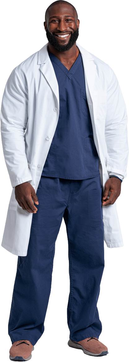 Healthcare staff wearing a white lab coat over navy blue scrubs.