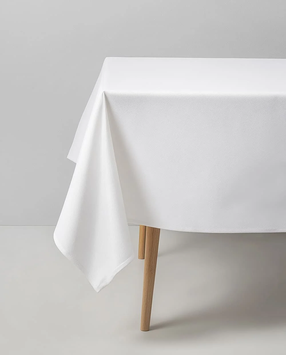 Tablecloths, White, in a variety of sizes.