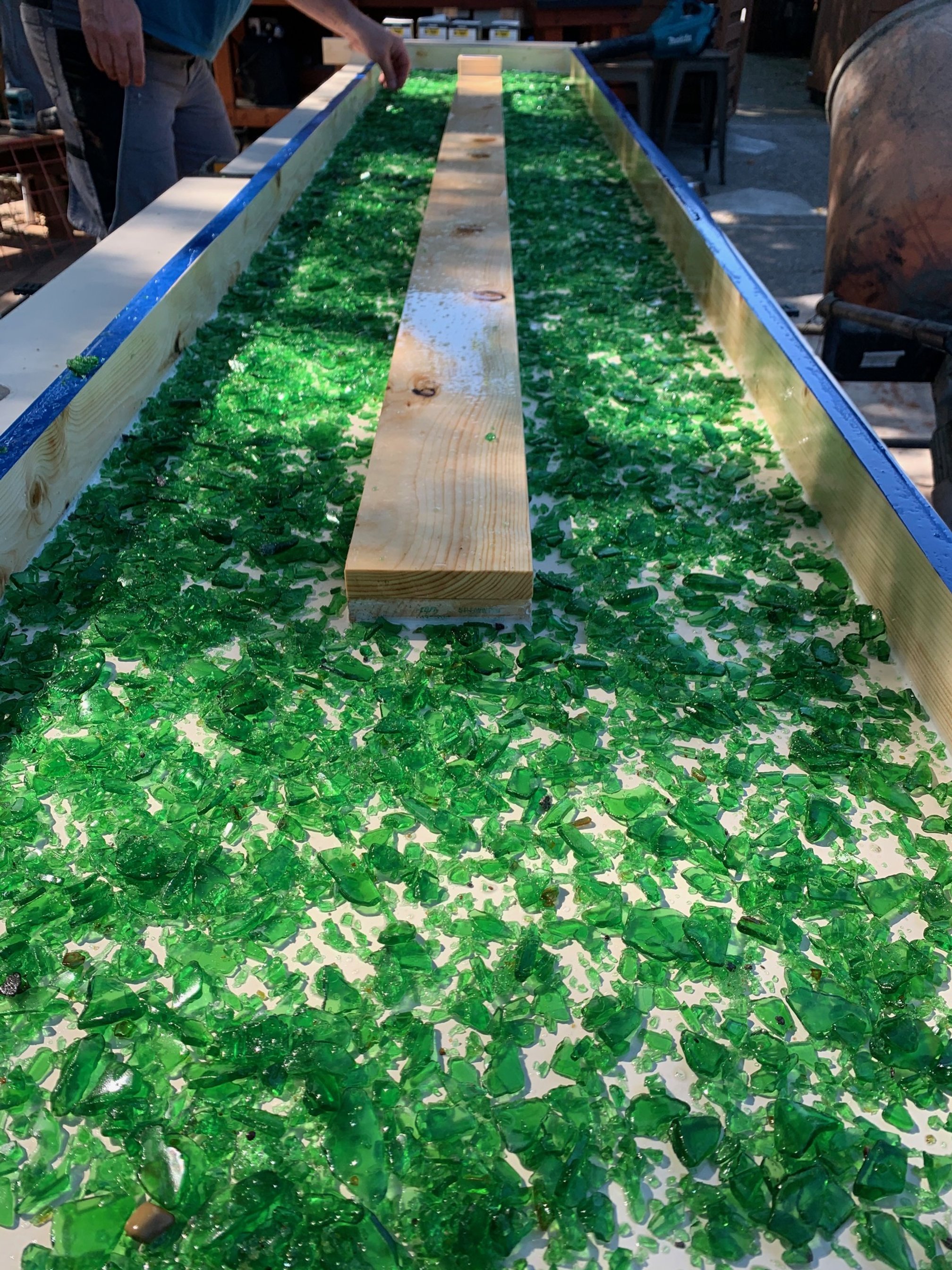 Pellegrino countertop in progress with crushed and sanded glass embedded in concrete
