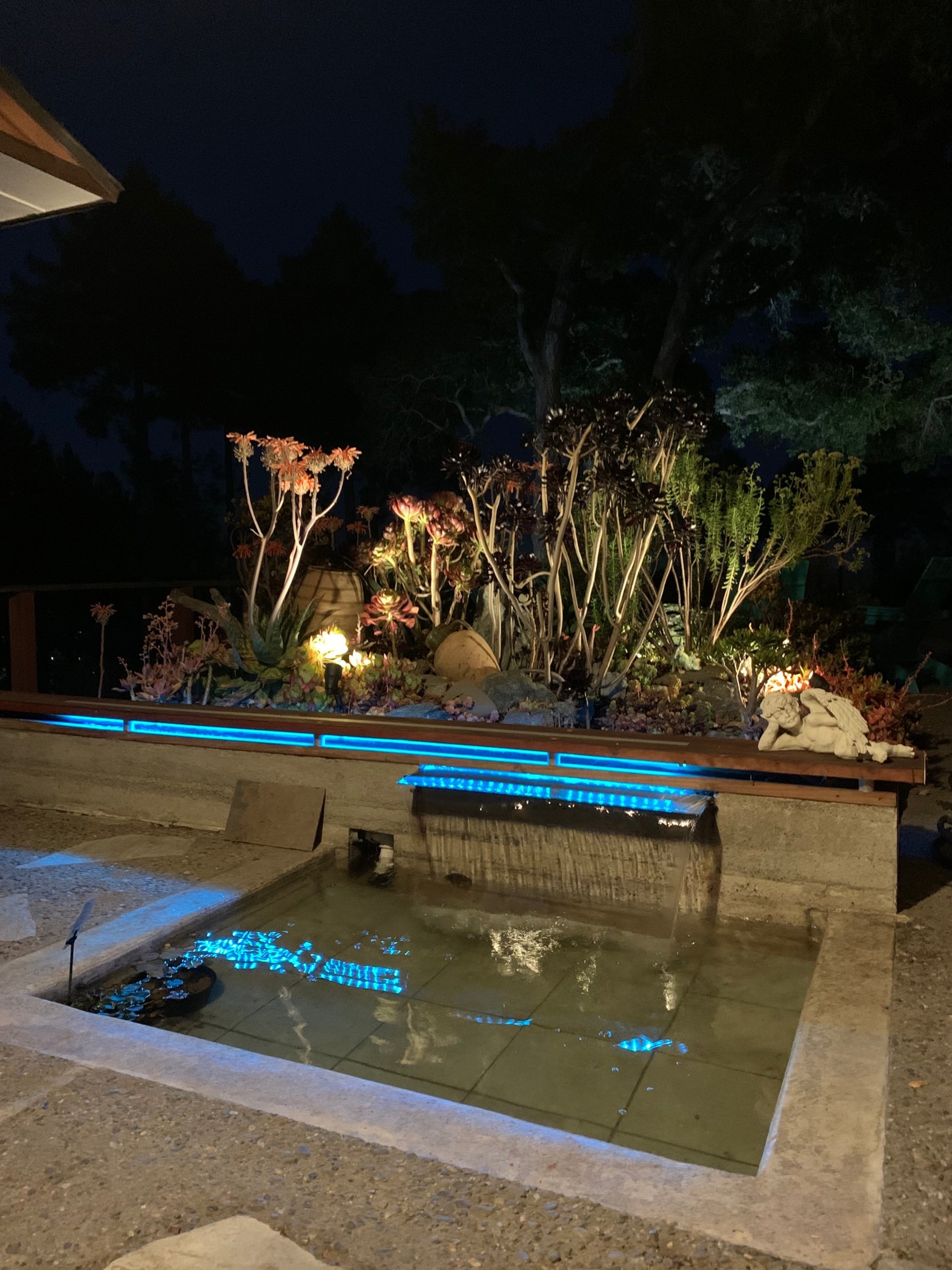 Rain water culvert/drain mud pit converted into a LED, Wifi enabled, reclaimed wood and aluminum water feature