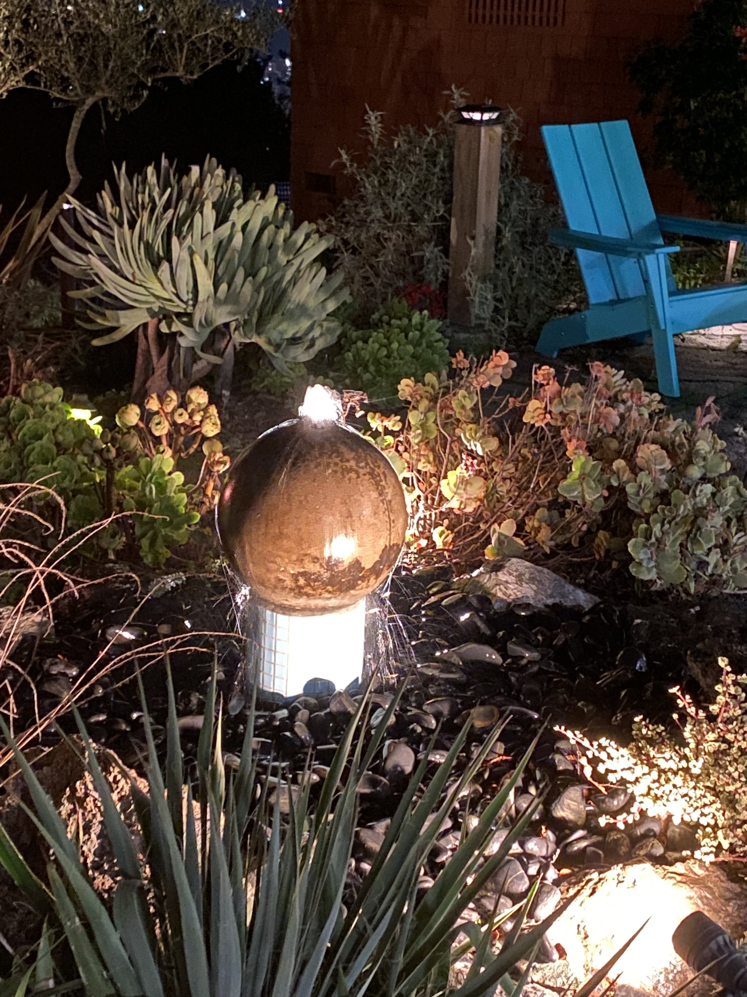 Orb fountain, on mid-century teal tiles to match  style of home - hummingbird attractor and occasional dog fountain