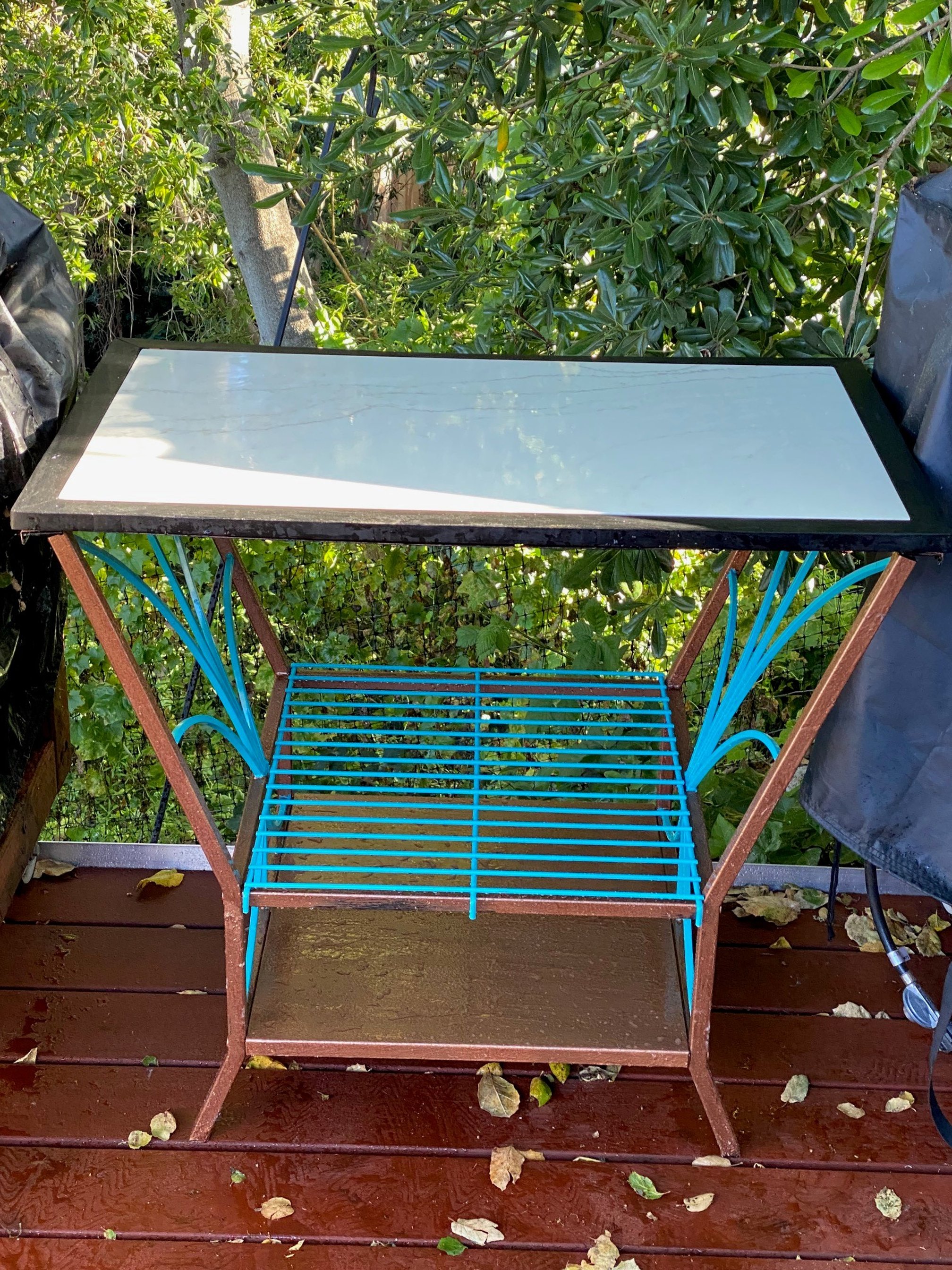 Road side discarded black and rusty table, converted into mid century modern with reclaimed marble top and wood patio table