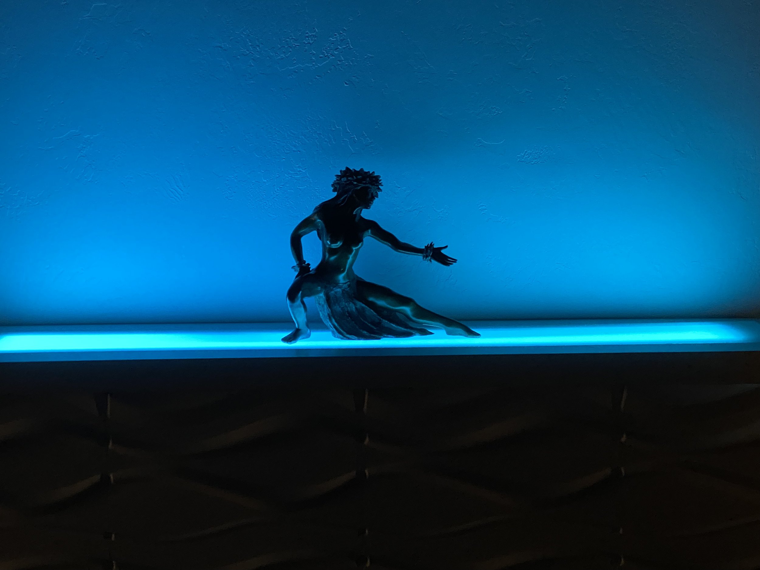 Built TV cabinet to highlight bronze sculpture with different LED colors