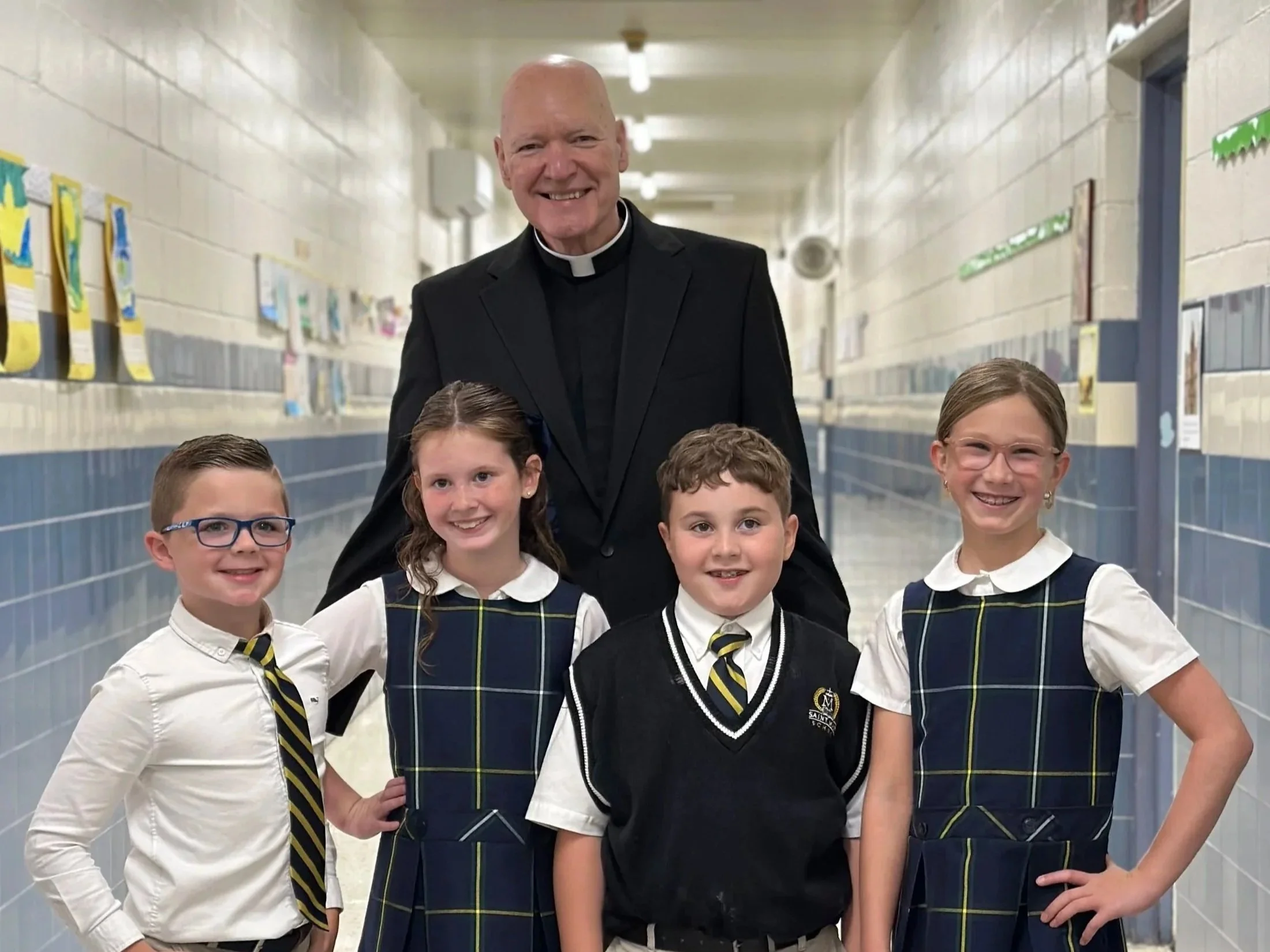 Silhouette of a cross against a purple and blue sunset sky