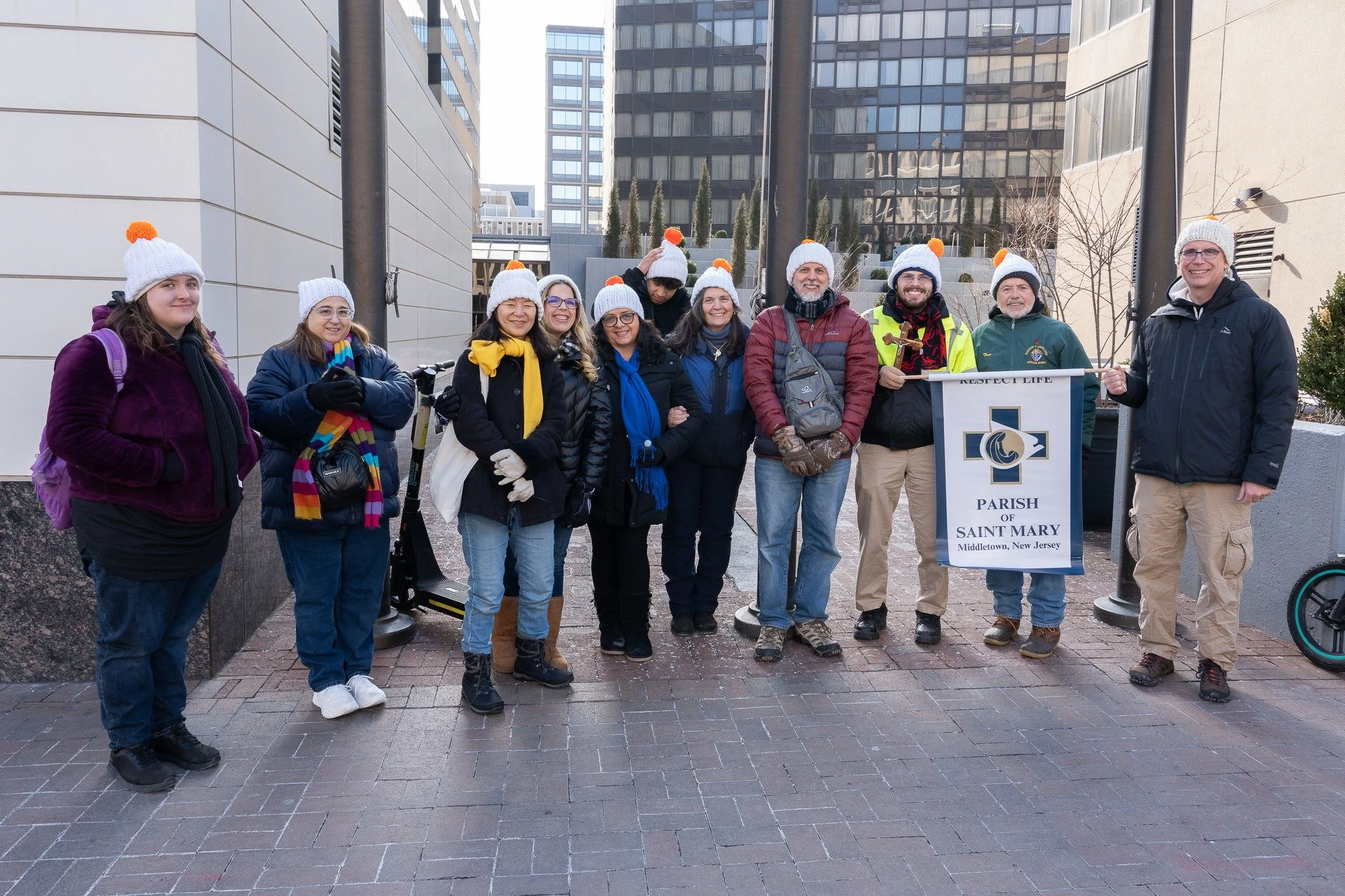 Silhouette of a cross against a purple and blue sunset sky