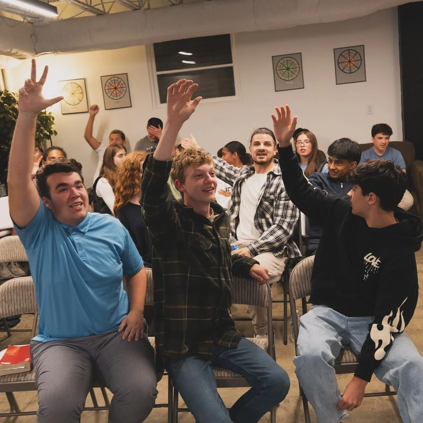 Silhouette of a cross against a purple and blue sunset sky