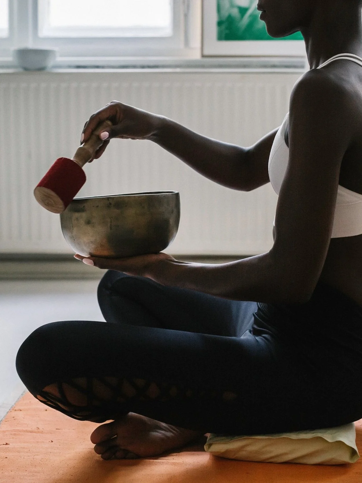 Profile Of Black Woman Performing Sound Healing
