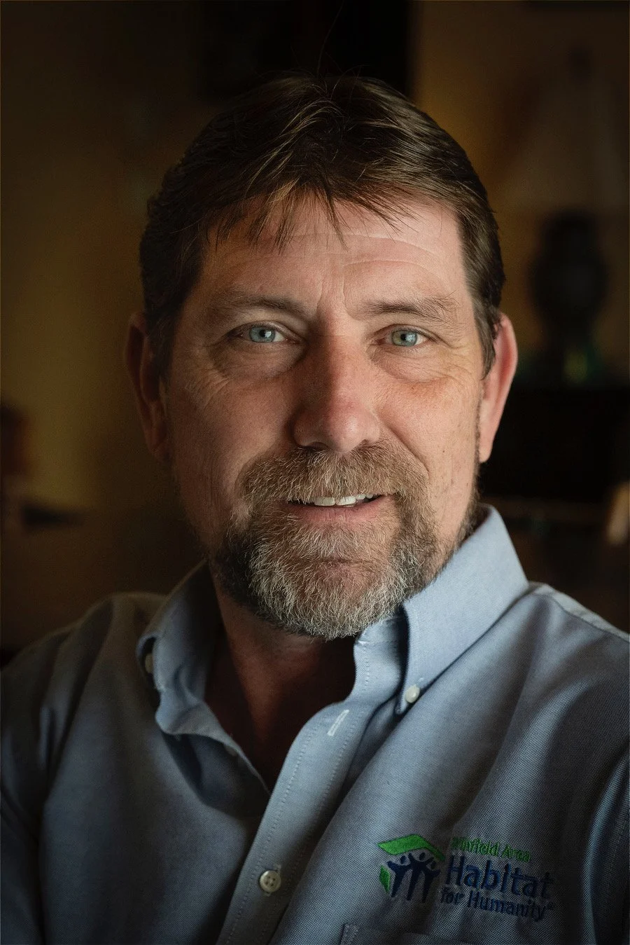 Smiling man with facial hair