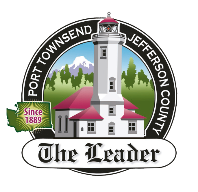 A logo featuring a lighthouse with a red roof, set against a mountain and forest background, surrounded by a circle with the text "Port Townsend Jefferson County". A green shape with the text "Since 1889" is on the left, and at the bottom, a white banner with black text reads "The Leader".