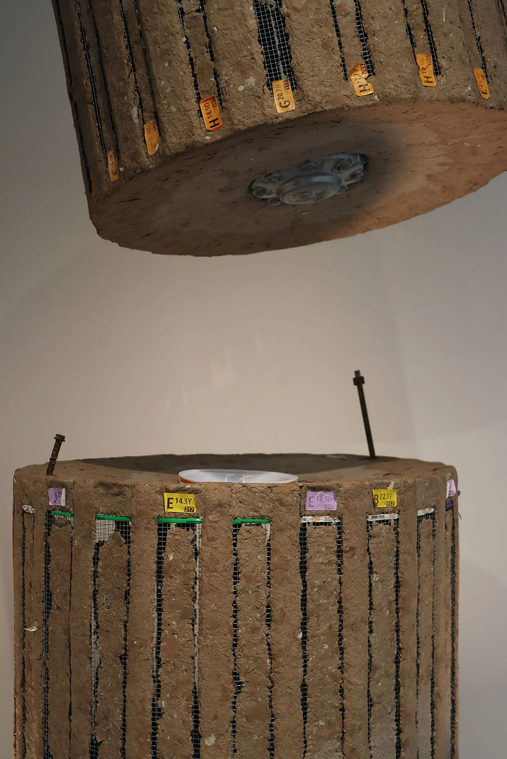 𝙎𝙡𝙤𝙬 𝙑𝙞𝙤𝙡𝙚𝙣𝙘𝙚 | 96x54 in. | Cardboard pulp, metal mesh, wheel cap, take-out container, silica gel bags, and miscellaneous waste.