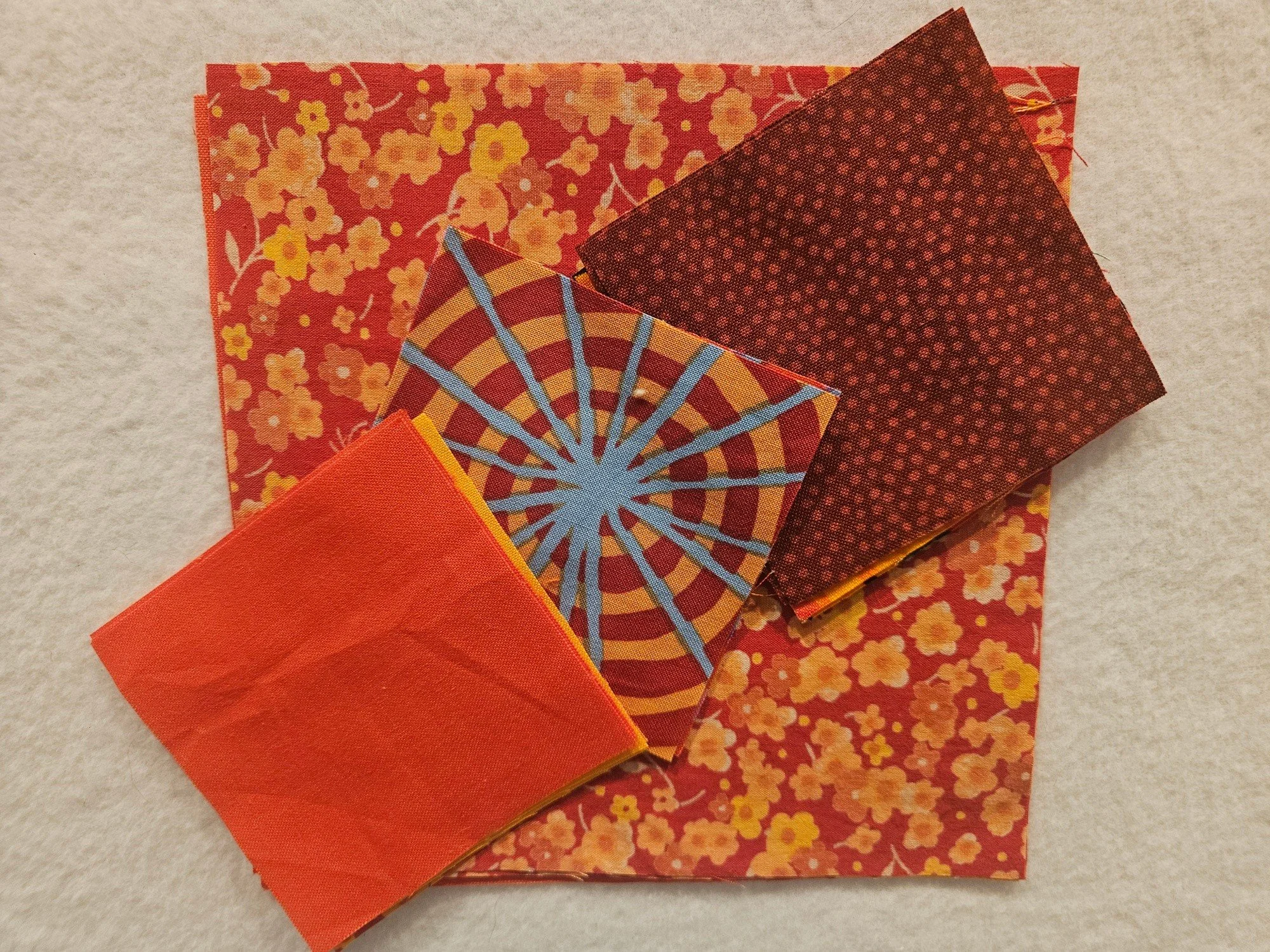 There's still time to collect your scraps for the swap at our meeting on Sunday.  Bring 20 3-inch and 20 6-inch squares of warm colored fabric.  Solids and prints welcome!