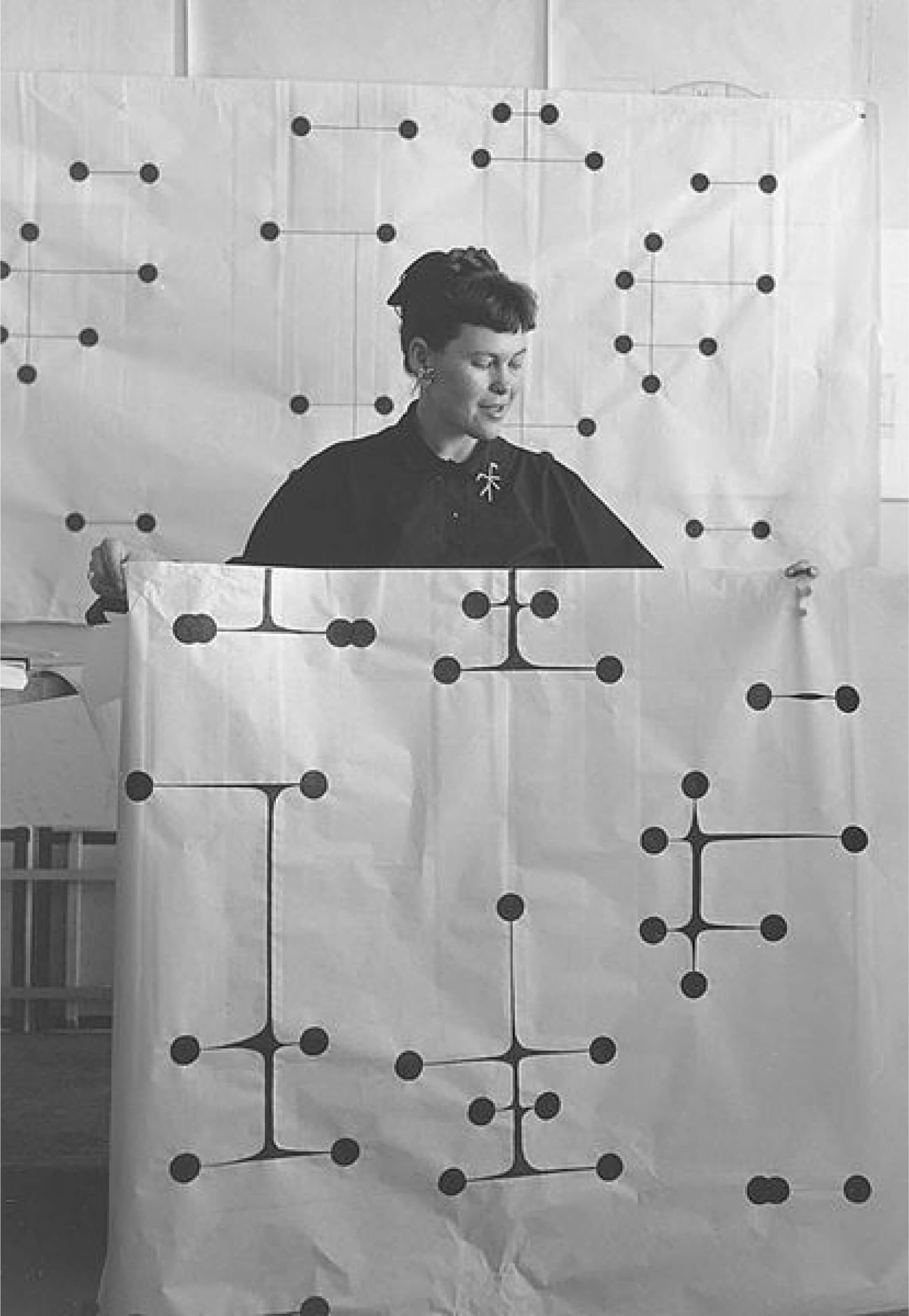 Ray Eames holding her famous Dot Pattern, 1947