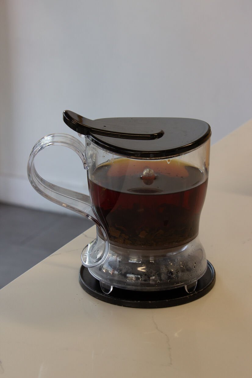 tea steeper with tea in it on counter
