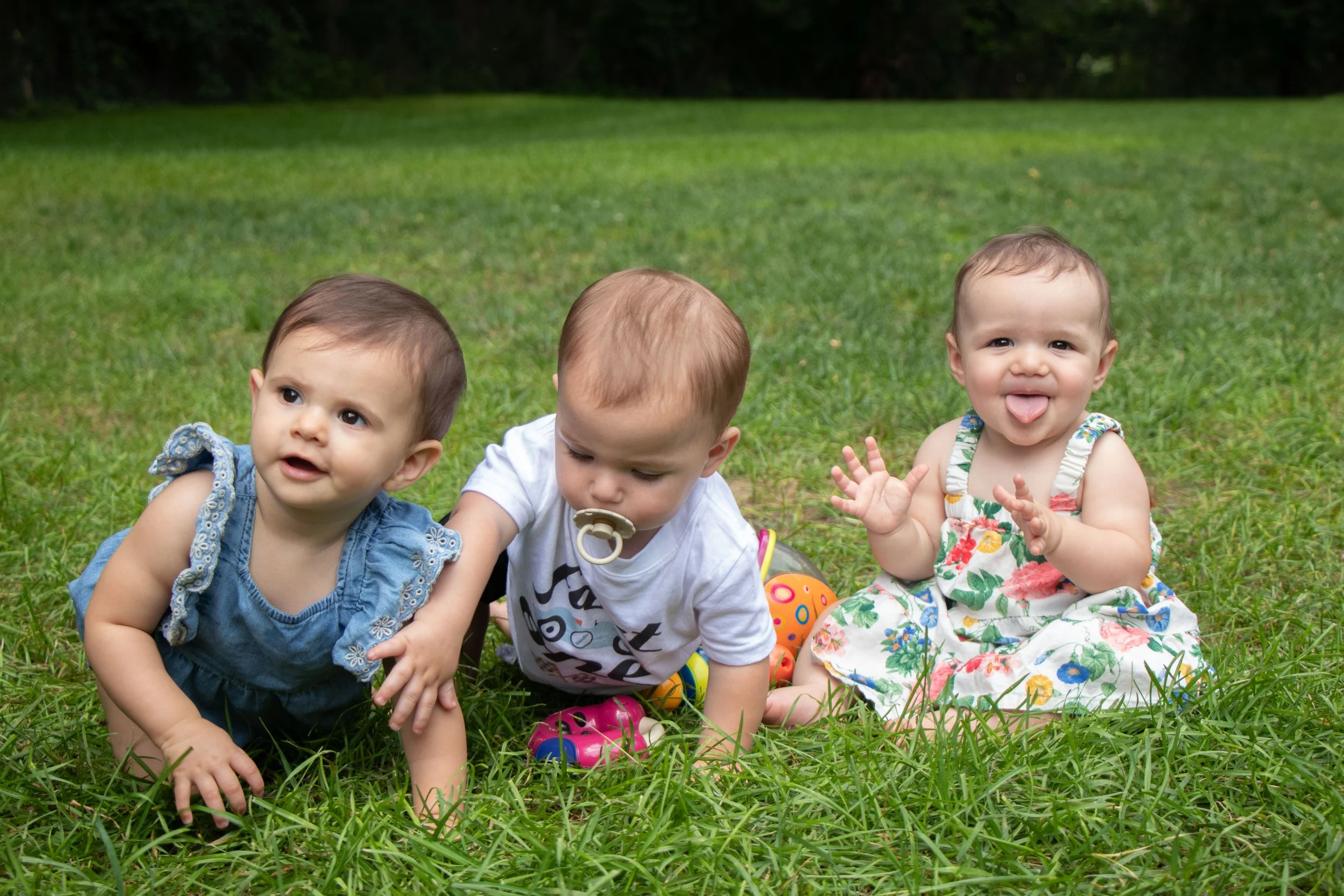 toddler trio in grass