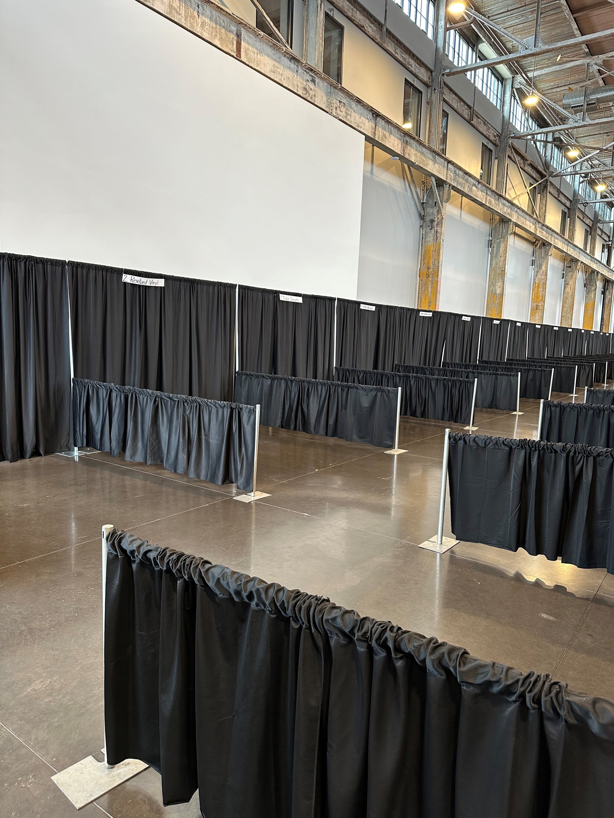 black pipe and drape trade booths.jpg