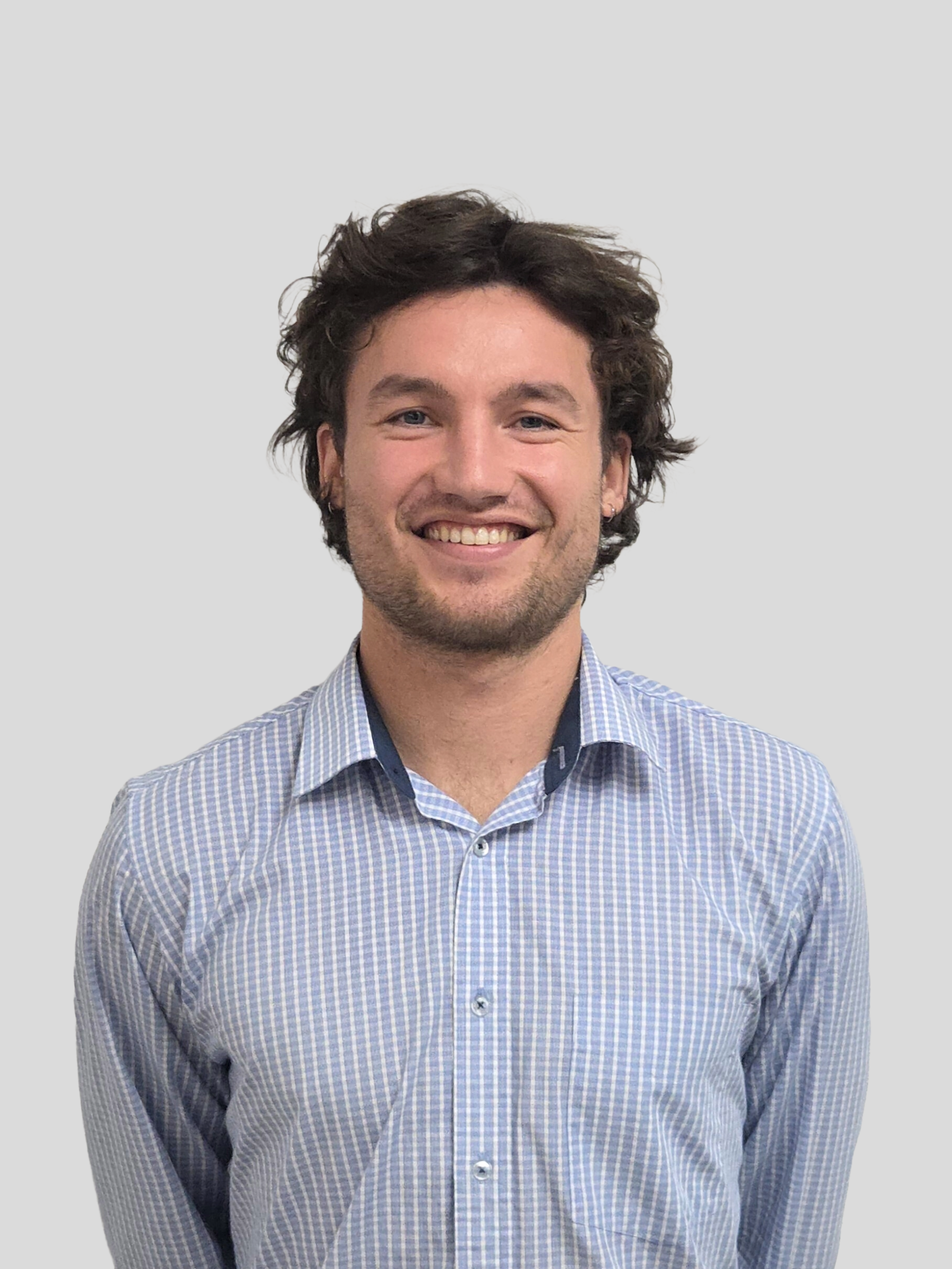 Man with blonde hair, moustache and blue eyes wearing black Dexion t-shirt.