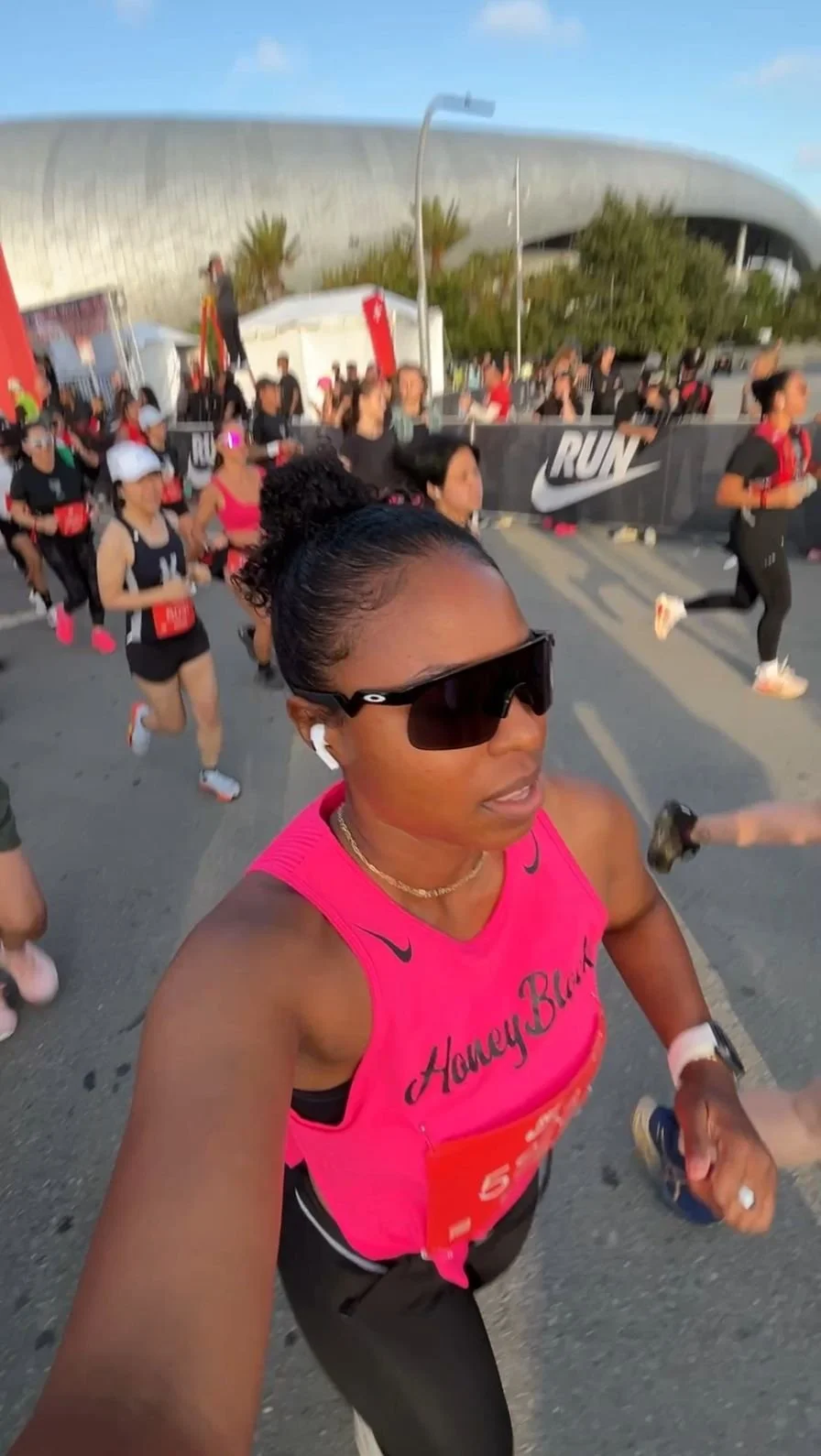 black women running in a pink tank top