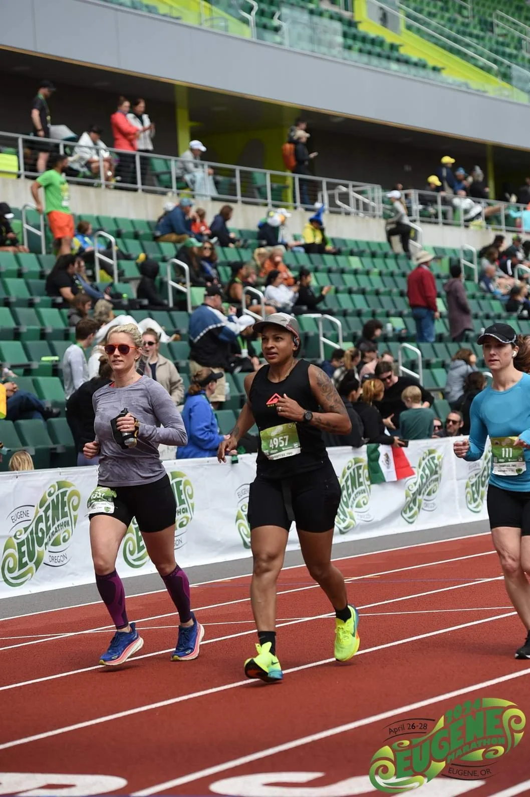 Athlete running towards the finish line at the Eugene Marathon
