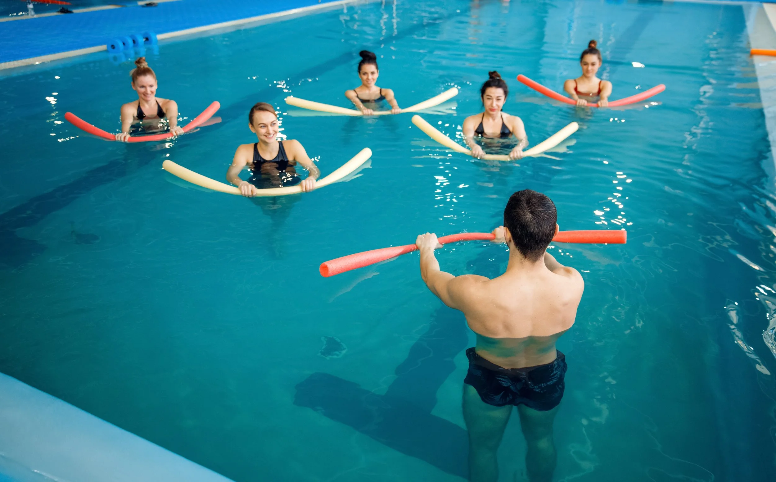 instructor-and-female-group-training-in-the-pool-2021-08-27-13-39-05-utc.jpg