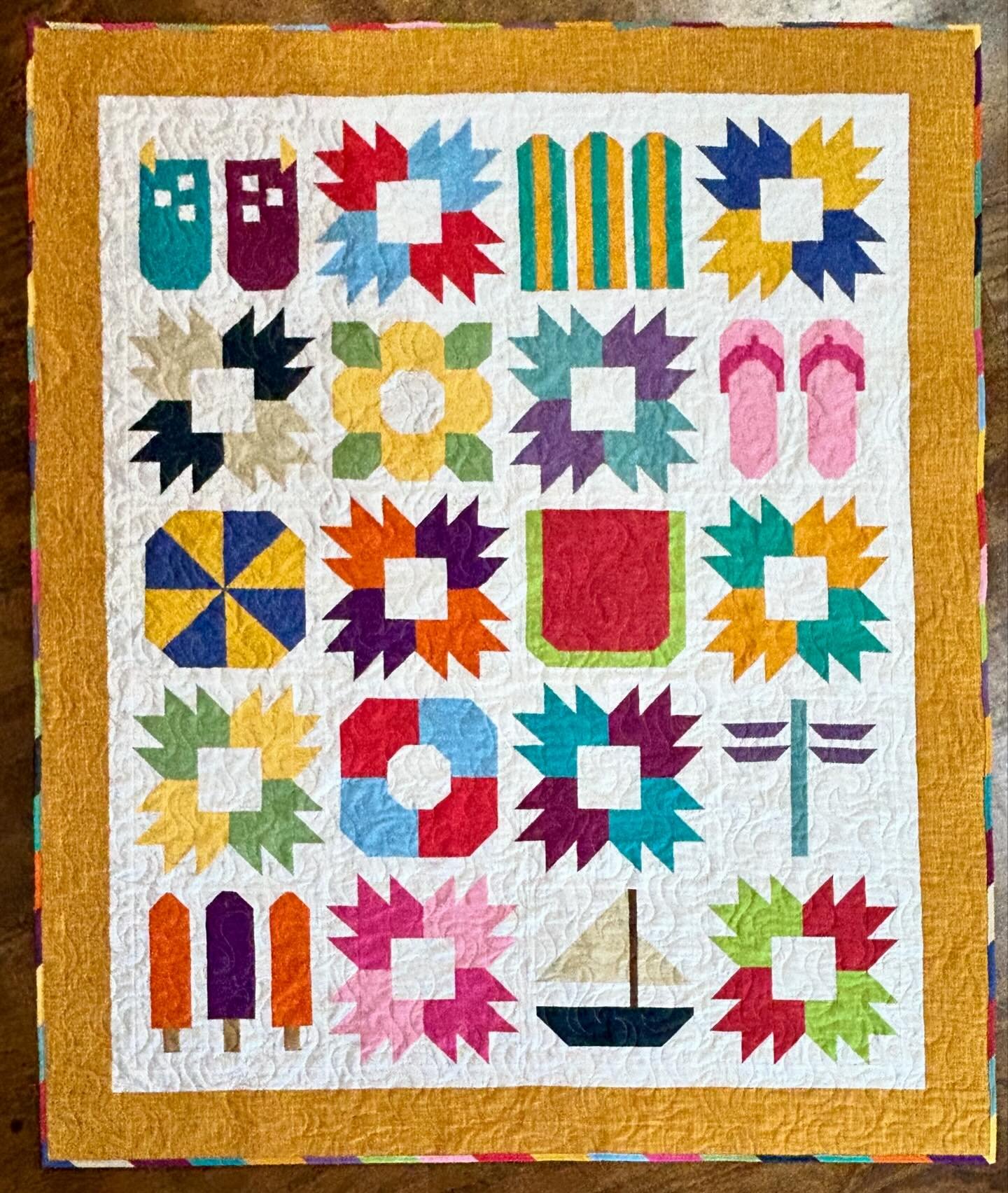 Here is my finished quilt for the Summer Chill Shop Hop coming next weekend (July 25-27)! We&rsquo;ve been hard at work preparing for this event but I love how the finished product turned out, especially with the multicolored binding. Grab your passp