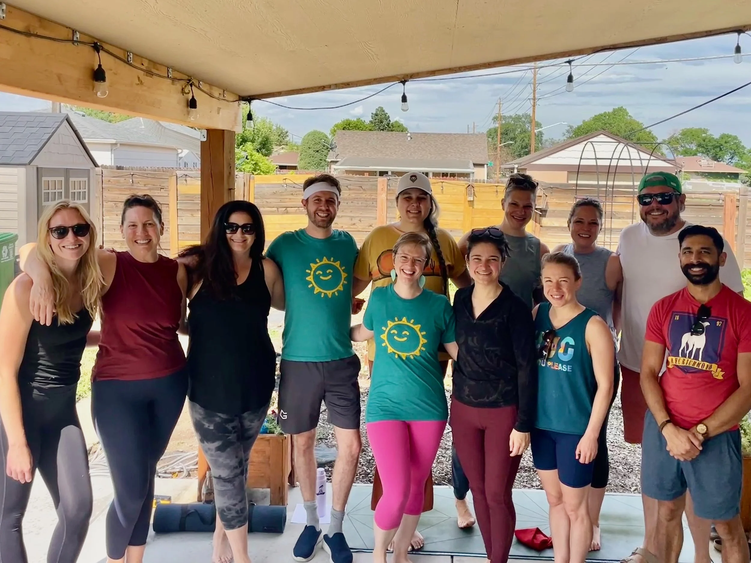 group of yoga students posing for a picture