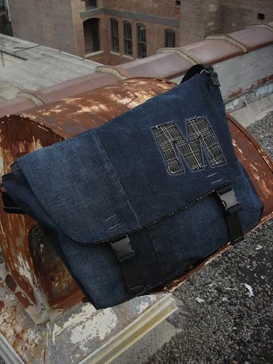 dark denim messenger bag alone.jpg