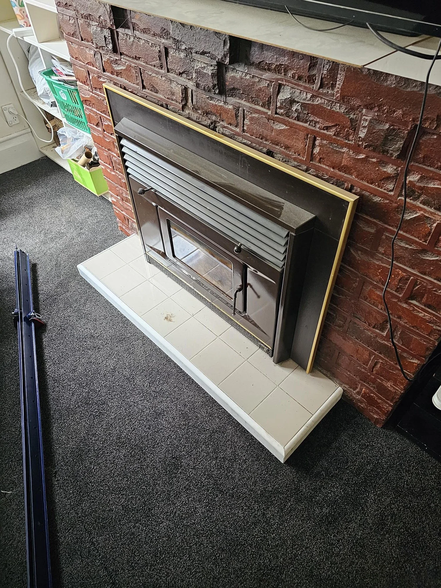 Broken tiled hearth repaired