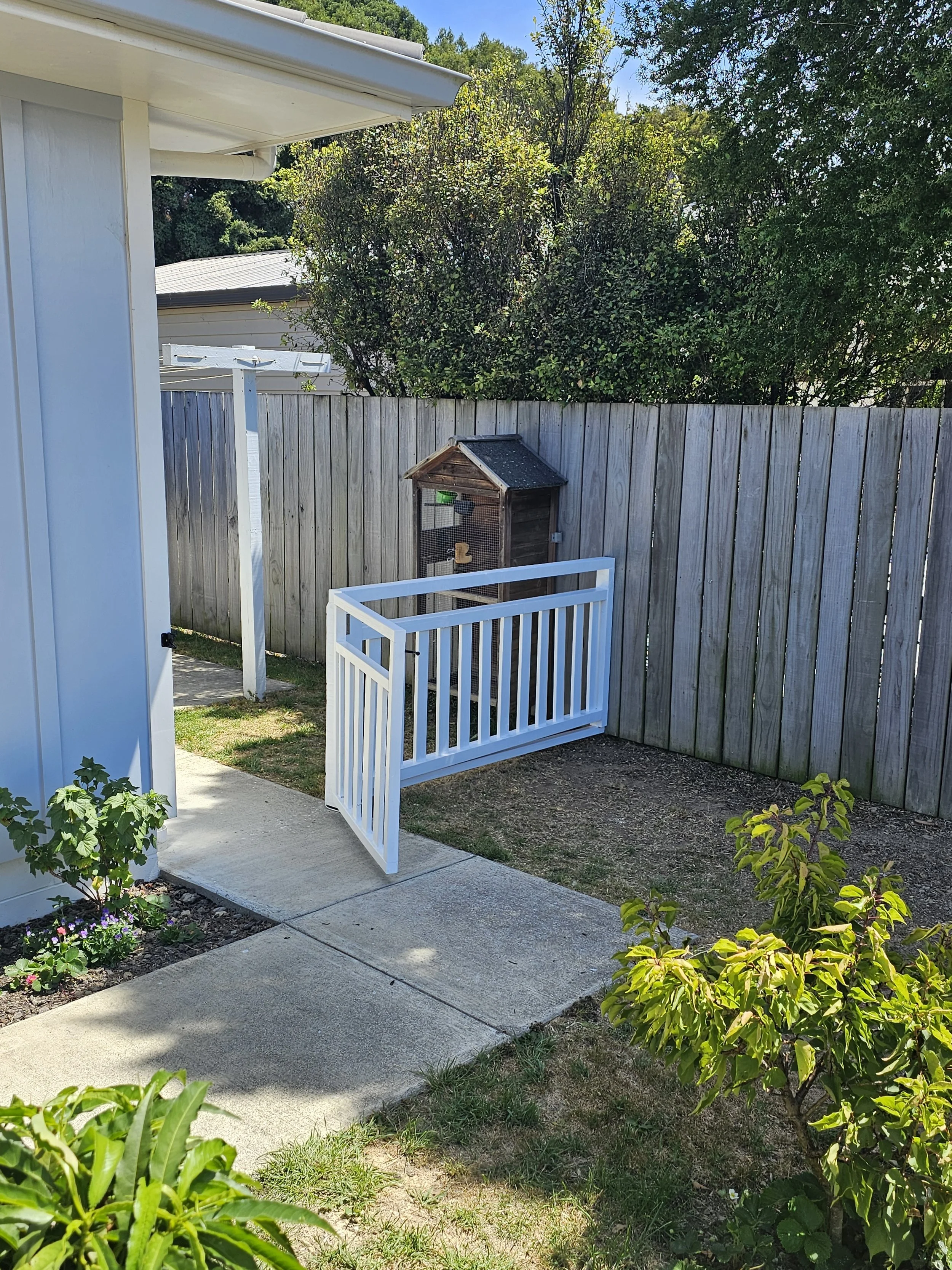 New fence and gate installed to keep in small dog
