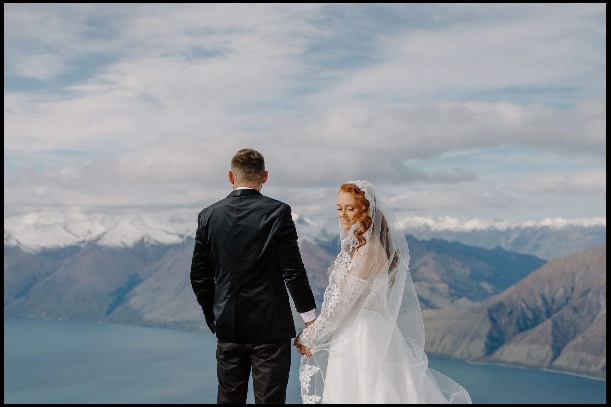 A couple eloped in the mountains above wanaka via helicopter on a snowy winter's day