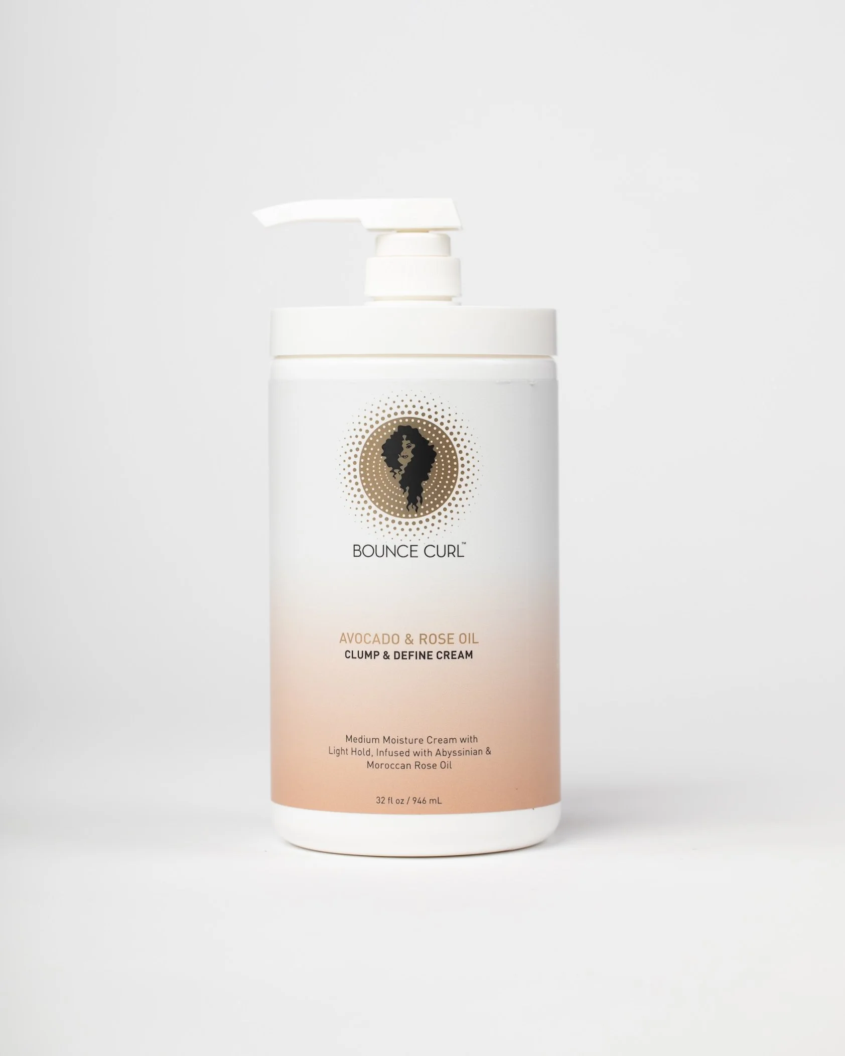 A white bottle of Bounce Curl Avocado & Rose Oil Clump & Define Cream with a pump dispenser on a plain white background.