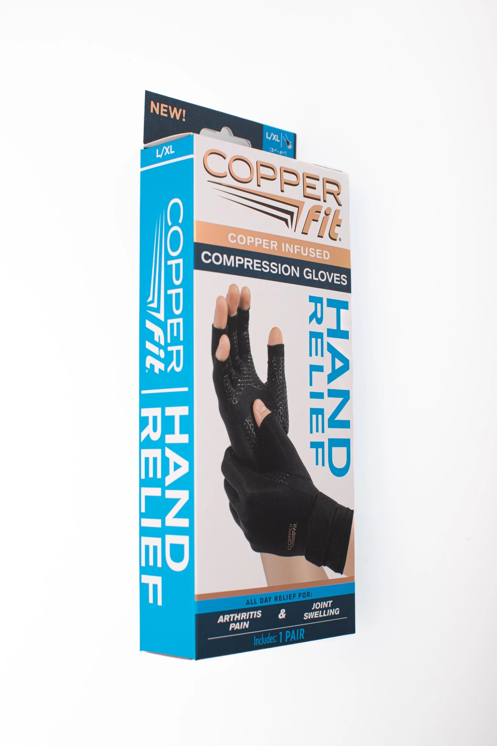 Packaging for Copper Fit Hand Relief compression gloves, black gloves with copper infusion, with text indicating relief from arthritis pain and joint swelling, includes one pair.