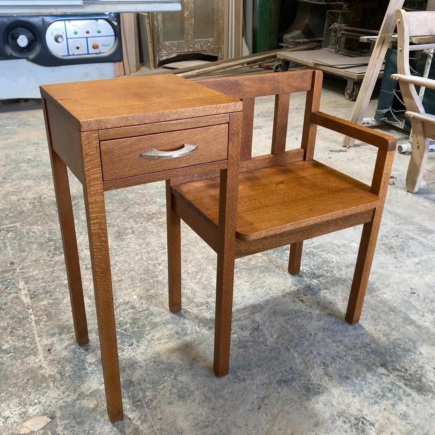 This beautifully restored Silky Oak Telephone Table&mdash;often referred to as a Gossip Chair. Dating from the 1950s to early 1960s
Whether used as a hallway accent, a reading nook seat, or simply as a conversation piece, this telephone table adds wa